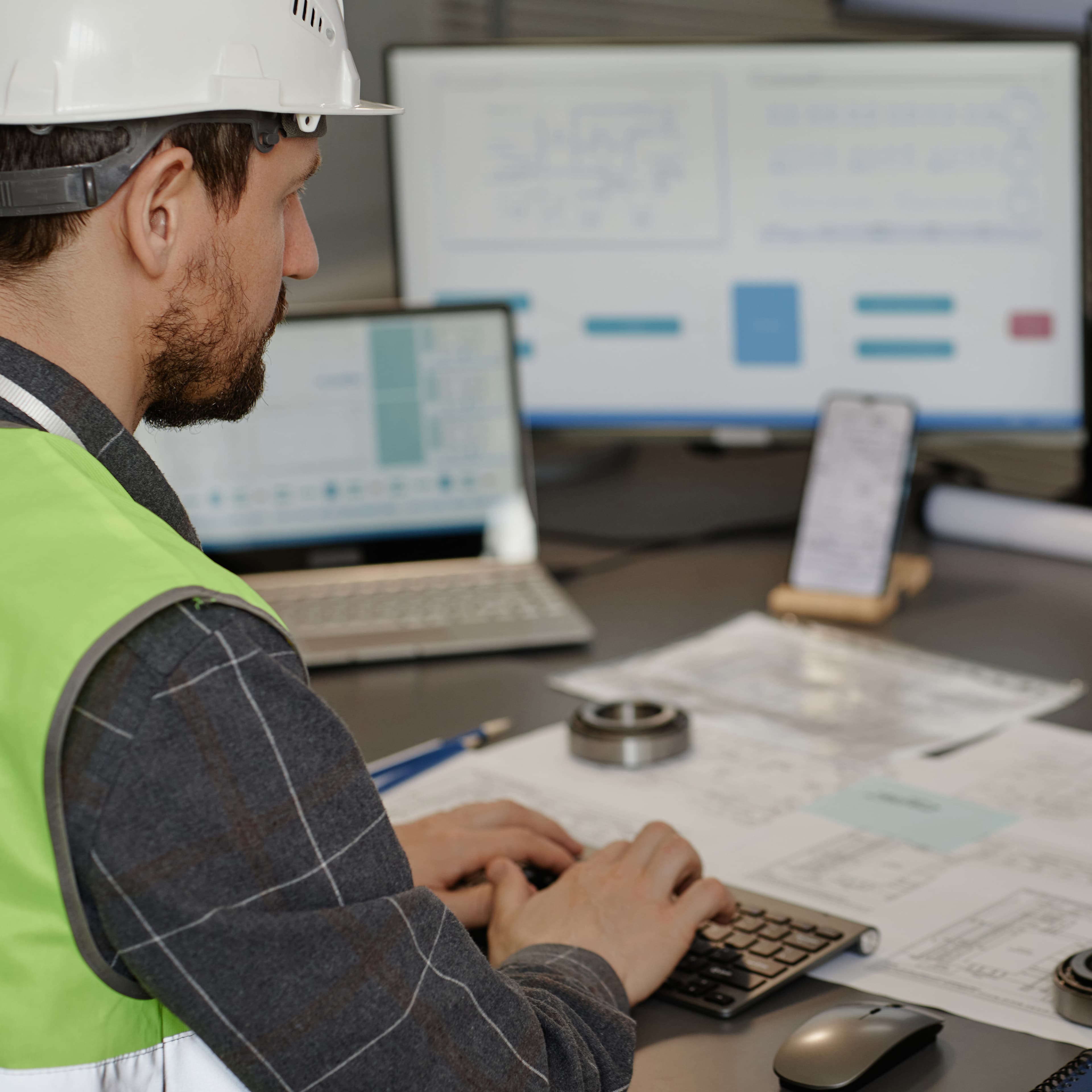male-engineer-wearing-hardhat-n-office-and-using-c-2025-03-05-16-31-01-utc1-1 male-engineer-wearing-hardhat-n-office-and-using-c-2025-03-05-16-31-01-utc1-1