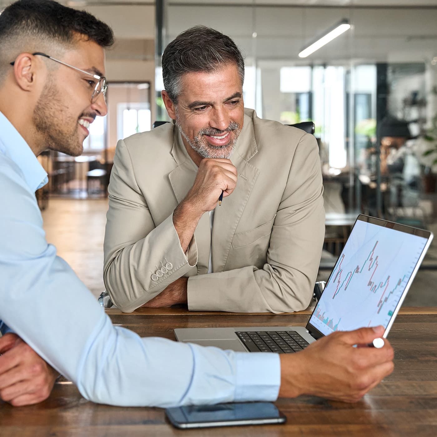 Financial advisor explaining Fringe Benefits Tax reporting to a customer. Financial advisor explaining Fringe Benefits Tax reporting to a customer.