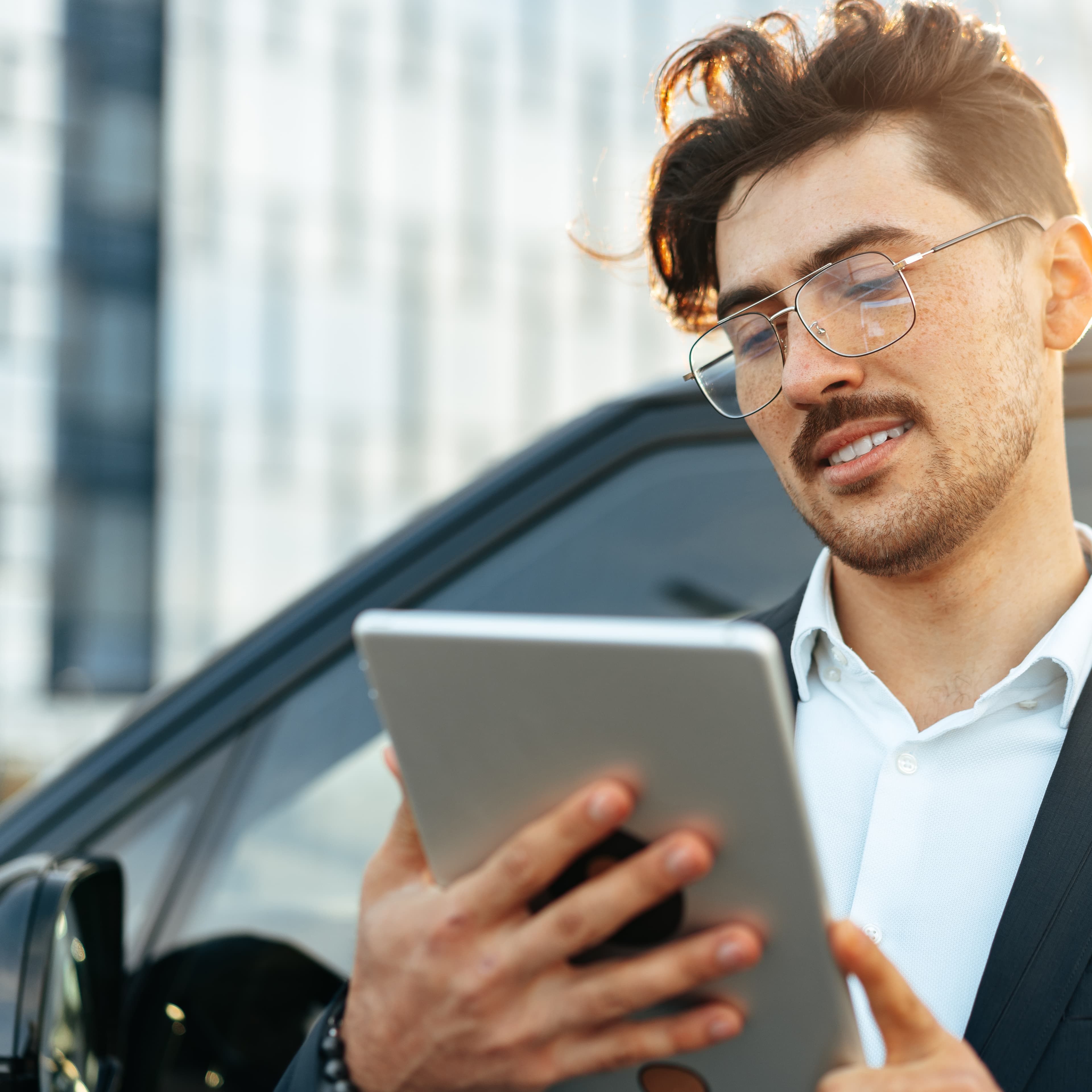 young-businessman-using-digital-tablet-while-stand-2025-02-24-22-50-26-utc1-1 young-businessman-using-digital-tablet-while-stand-2025-02-24-22-50-26-utc1-1